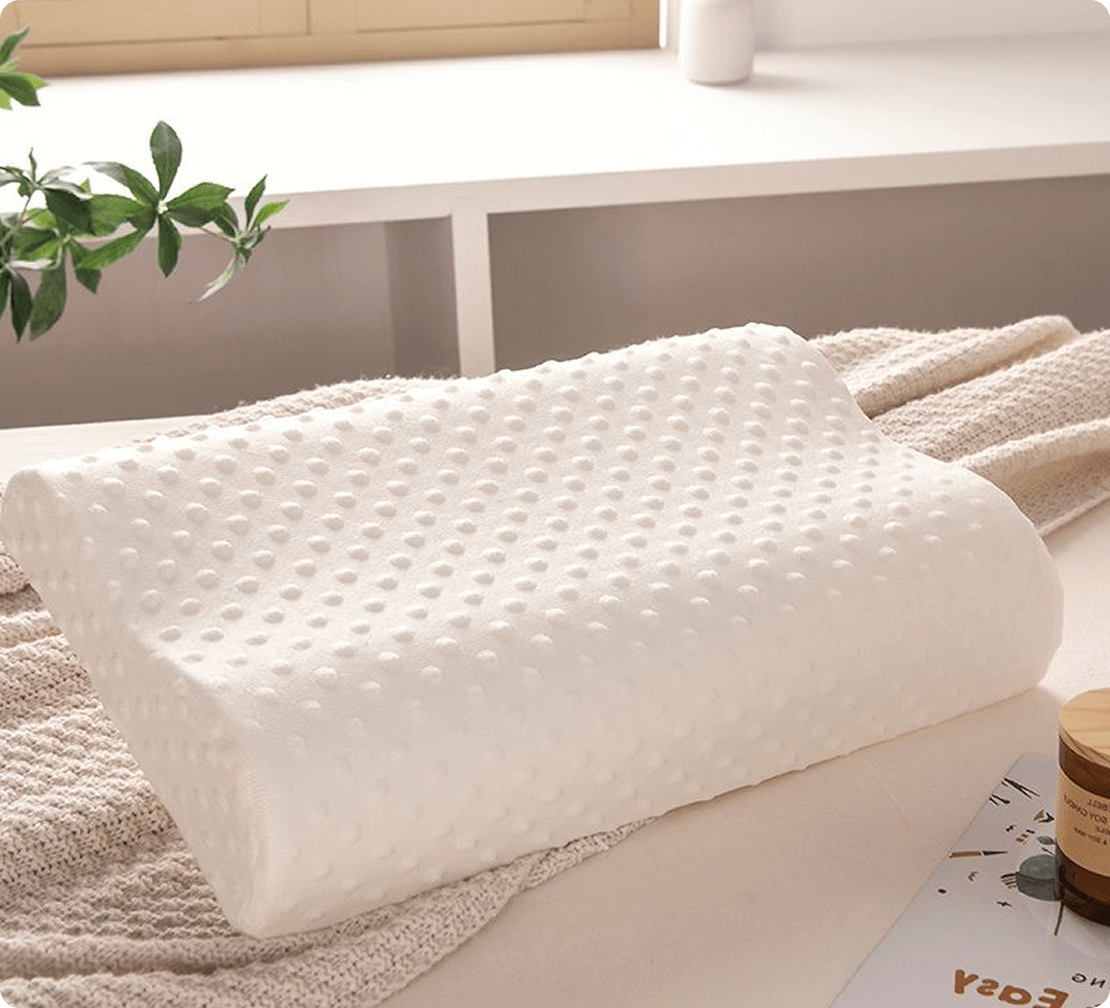 alt="Comfortable Spino pillow on bed – healthy sleep essential"
