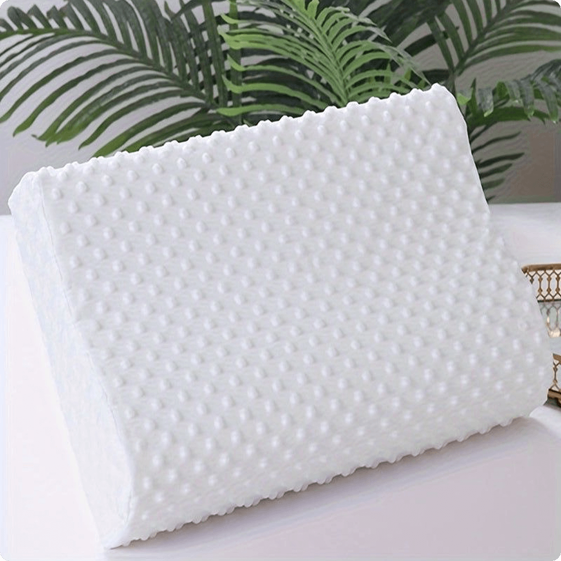 alt="Spino memory foam pillow on bed with plant – modern and organic look"